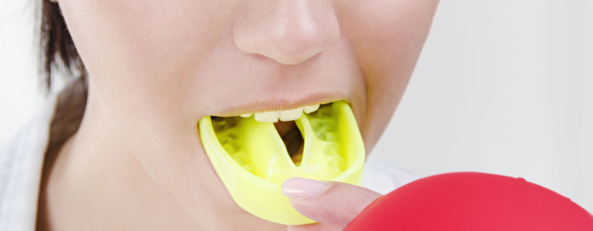 Young girl wearing sport mouth guard