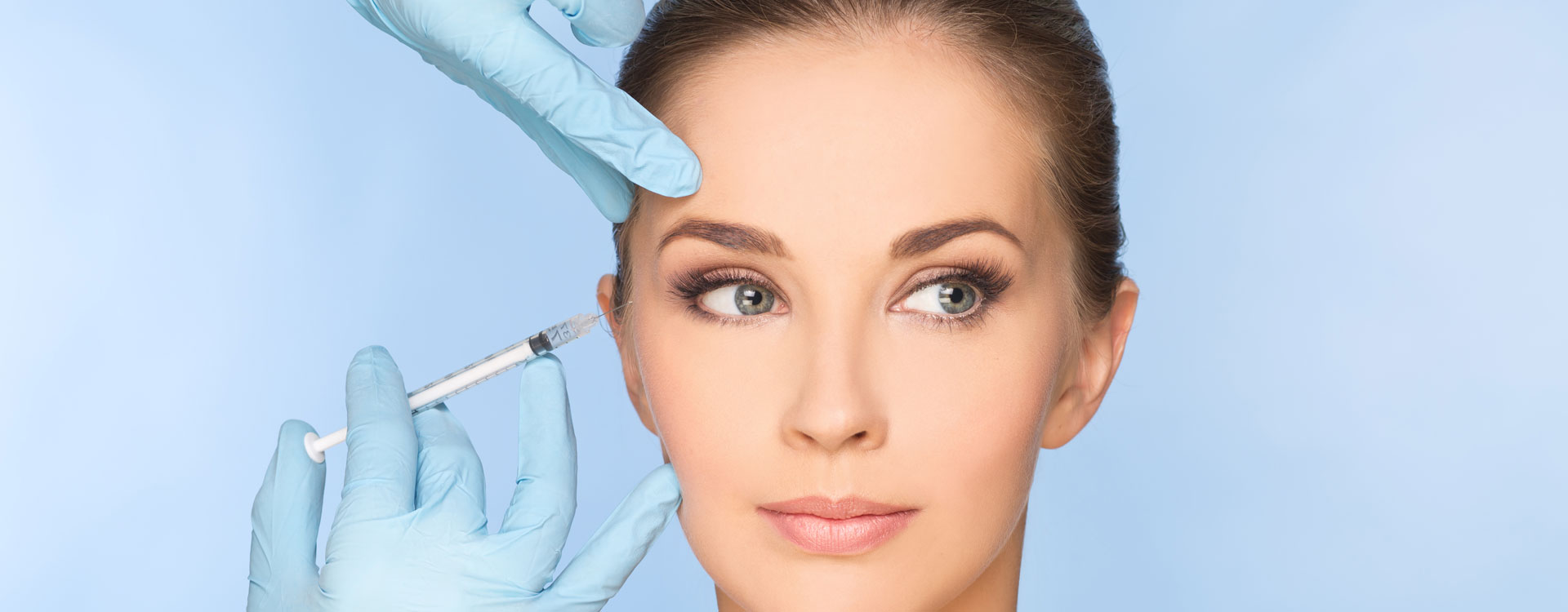 Beauty woman giving botox injections.