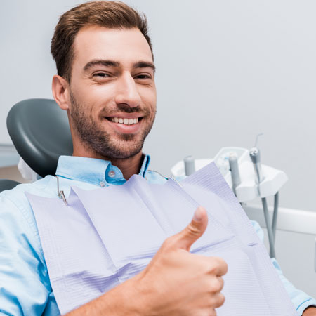 Man sitting on dental chair